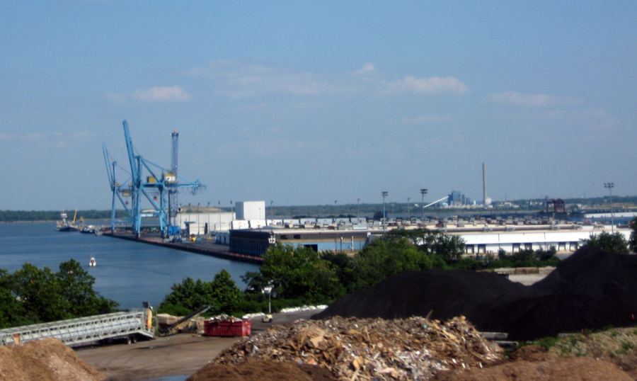 Archive: Port of Wilmington, Delaware, on the Christina River / Delaware River waterfront with container gantry cranes, seen from Interstate 495, 9 Jul 2011 (Diiscool, CC0). Not the 14 September 2026 Delaware Container Terminal groundbreaking at Edgemoor, not Enstructure/DSPC ceremony stills, not electric STS/RTG day-of, and not protest photography.