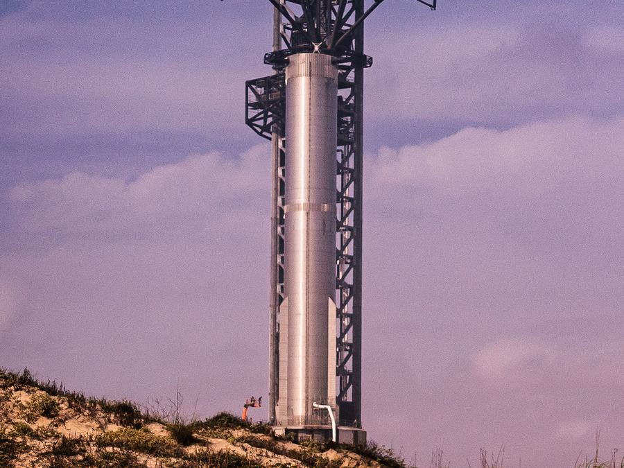 Archive: SpaceX Super Heavy booster B7 on the orbital launch mount at Starbase, Boca Chica, Texas, beside the launch tower, 24 Feb 2023 (Mobilus In Mobili, CC BY-SA 2.0). Not Starship Flight 14, not the FAA 22 September 2026 airspace window, not Booster 21 / Ship 41, and not a 2026 countdown still.