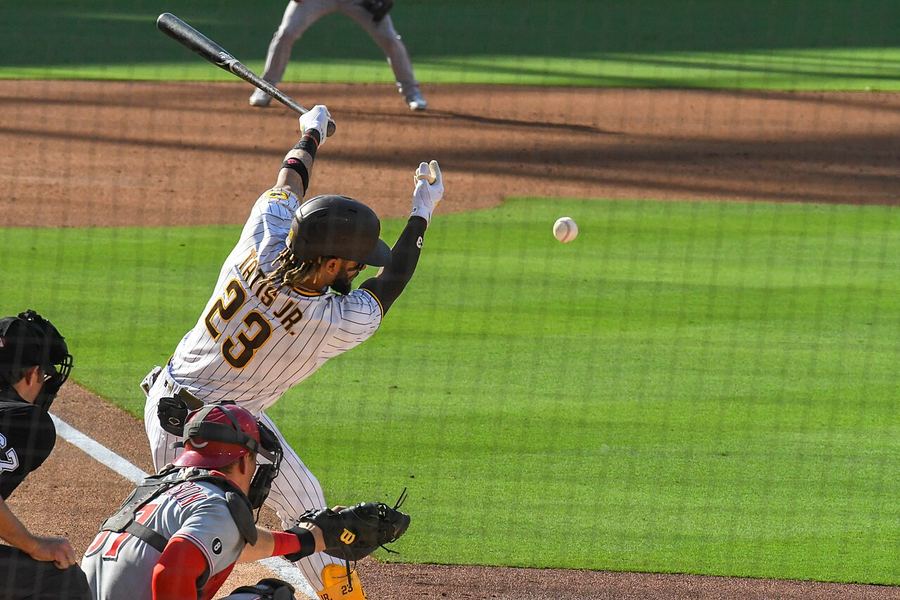 Archive: Fernando Tatis Jr. mid-swing follow-through #23, Padres white home pinstripes, Petco-style action vs Reds, 19 Jun 2021 (Ryan Casey Aguinaldo / Wikimedia Commons, CC BY-SA 4.0). Not the 18 September 2026 Padres–Marlins WC three-way-tie, not a Petco day-of celebrate still, and not a Marlins WC-tie still.
